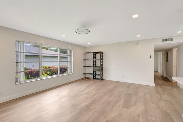 spare room featuring light hardwood / wood-style flooring