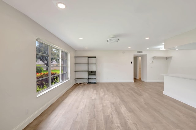 unfurnished room with light hardwood / wood-style floors