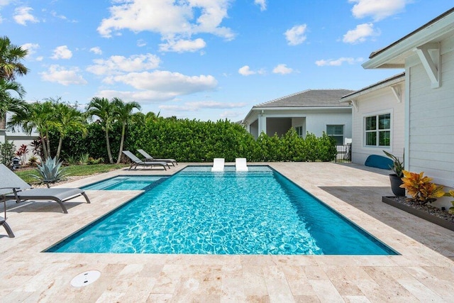 view of pool featuring a patio area