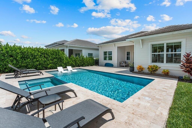 view of swimming pool with a patio