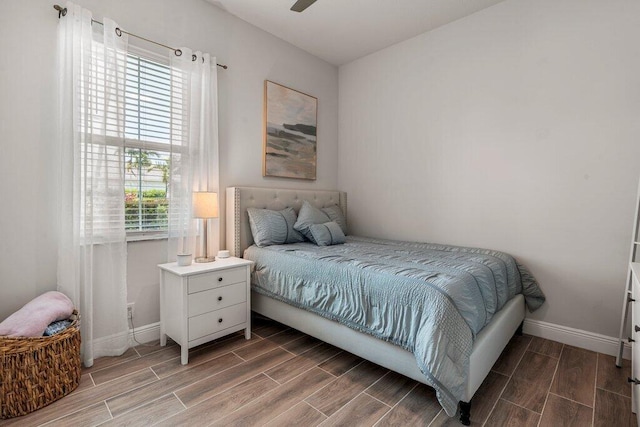 bedroom featuring wood-type flooring and ceiling fan