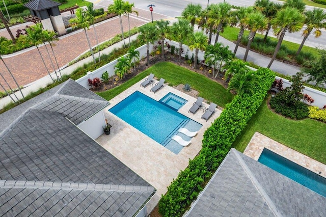 view of pool with a yard and a patio area