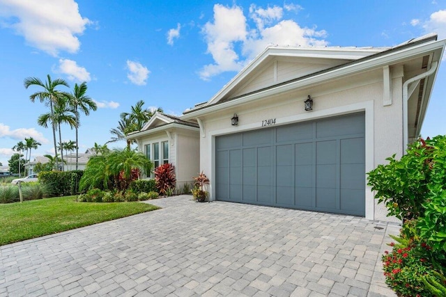 ranch-style house with a front lawn and a garage