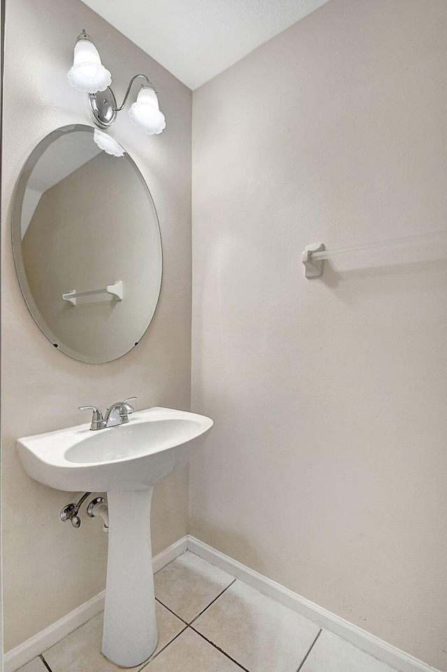 bathroom with tile patterned floors