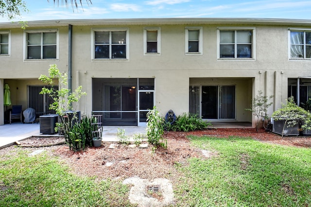 back of property featuring a patio area and central air condition unit