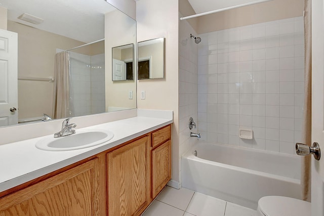 full bathroom featuring tile patterned flooring, vanity, toilet, and shower / bath combo with shower curtain