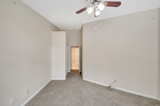 carpeted spare room with ceiling fan