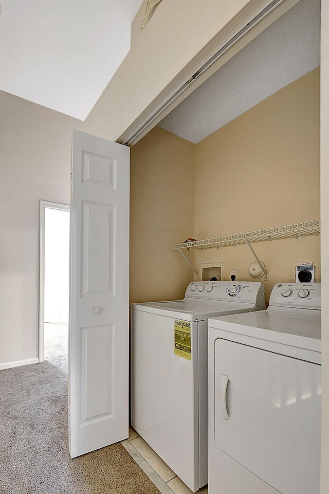 washroom featuring light colored carpet and independent washer and dryer