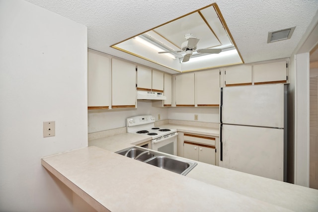 kitchen with kitchen peninsula, a textured ceiling, white appliances, ceiling fan, and sink