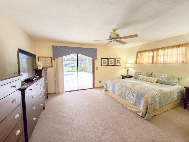 carpeted bedroom featuring a textured ceiling, access to outside, and ceiling fan