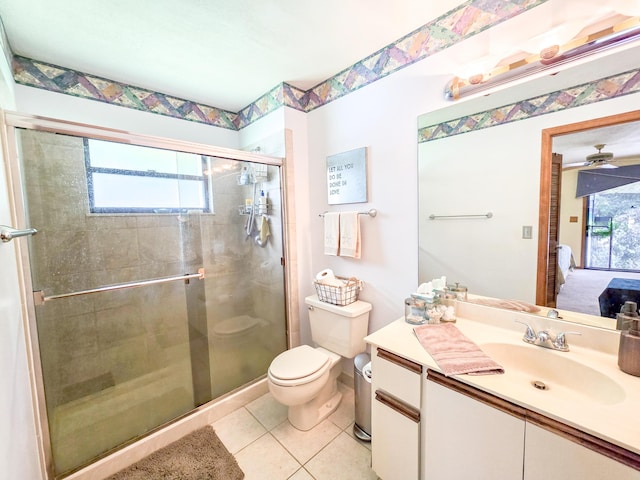 bathroom featuring tile patterned flooring, vanity, plenty of natural light, and walk in shower