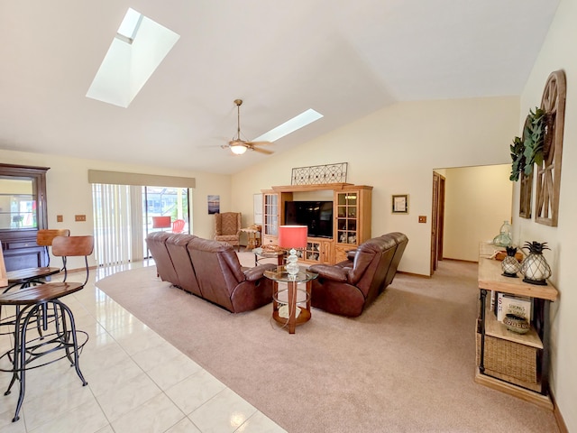 living room with light tile patterned floors, ceiling fan, and lofted ceiling