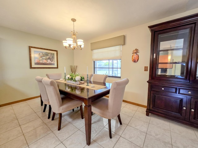 tiled dining area featuring a notable chandelier