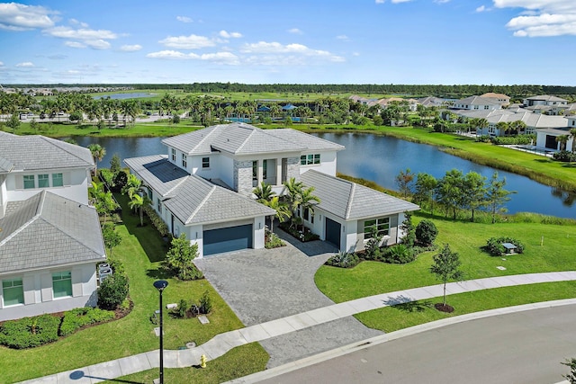 birds eye view of property with a water view