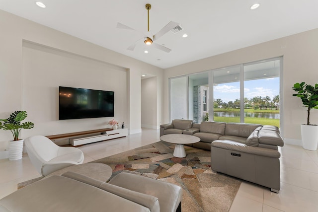 tiled living room featuring ceiling fan