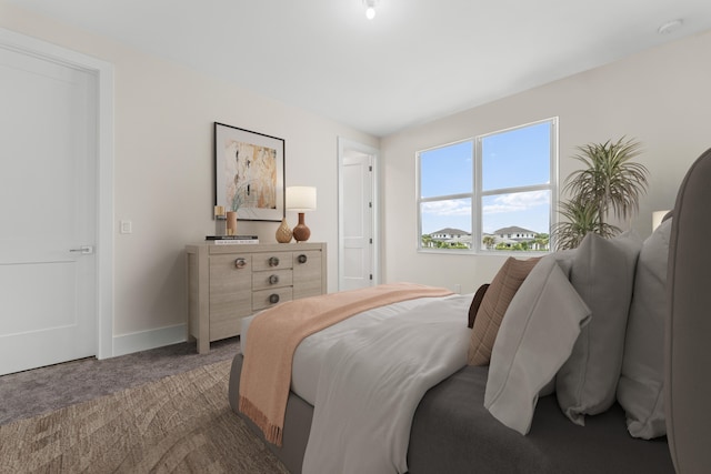 bedroom featuring dark colored carpet