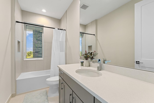 full bathroom featuring vanity, toilet, tile patterned floors, and shower / bathtub combination with curtain