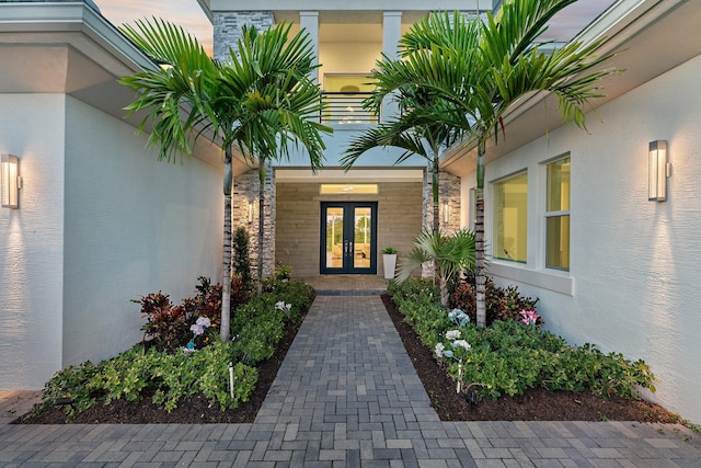 exterior entry at dusk with french doors