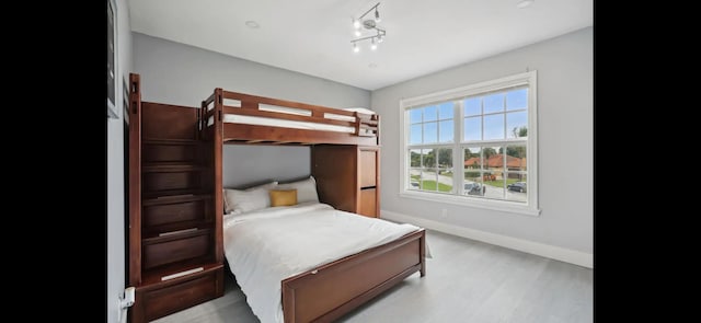 6785 Escondida Dr, Lake Clarke Shores, FL 33406 - bedroom with baseboards and light wood-type flooring