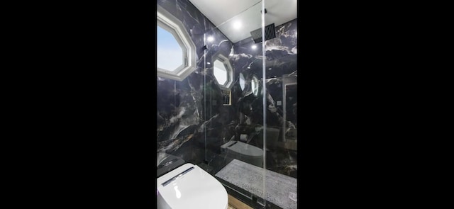 6785 Escondida Dr, Lake Clarke Shores, FL 33406 - full bathroom featuring toilet, tile walls, and a marble finish shower