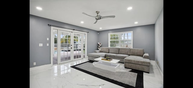 living room featuring light tile patterned flooring, french doors, and ceiling fan