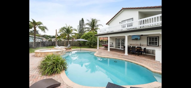 6785 Escondida Dr, Lake Clarke Shores, FL 33406 - view of pool with a pool with connected hot tub, french doors, a patio, a fenced backyard, and ceiling fan