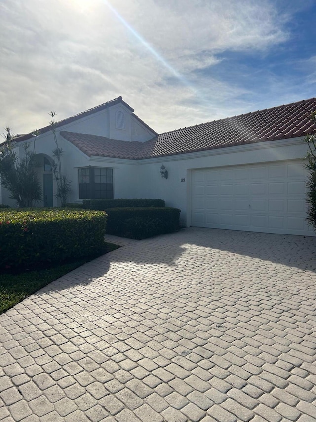 single story home featuring a garage