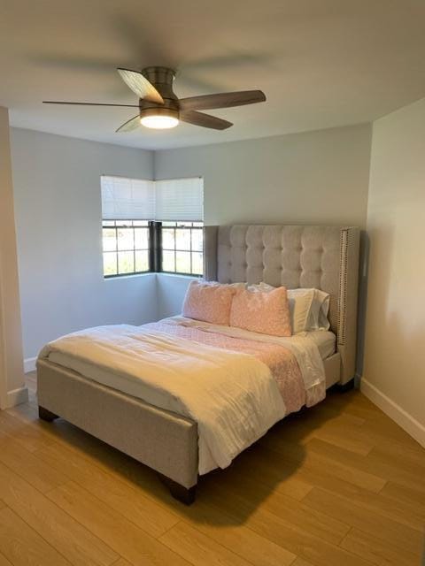 bedroom featuring ceiling fan and light wood-type flooring