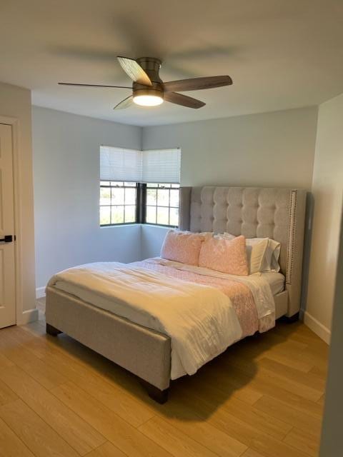 bedroom featuring ceiling fan and light hardwood / wood-style flooring