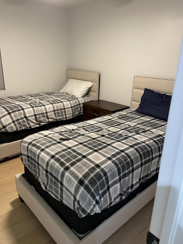 bedroom with light wood-type flooring