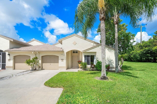 mediterranean / spanish-style house featuring a garage and a front yard