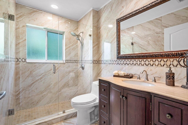 bathroom featuring decorative backsplash, toilet, an enclosed shower, vanity, and tile walls