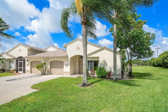 view of front of property with a front lawn and a garage