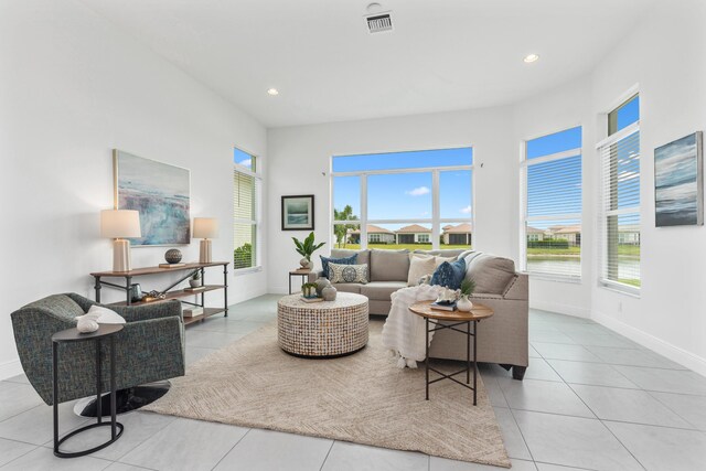 tiled living room with plenty of natural light