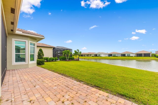 exterior space with a lanai and a water view