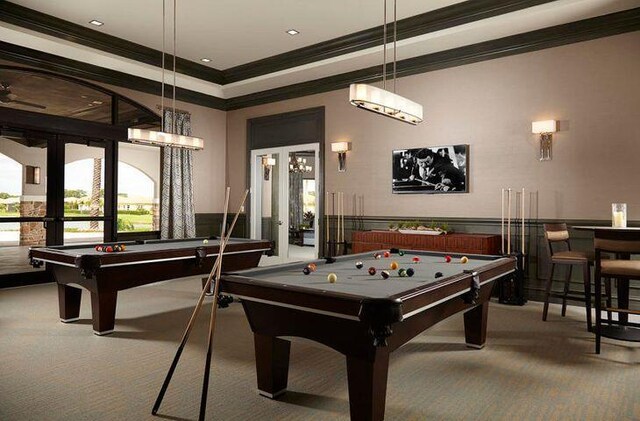 rec room featuring carpet, pool table, french doors, and a tray ceiling