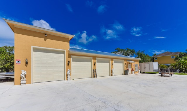 exterior space with an outdoor structure and a garage