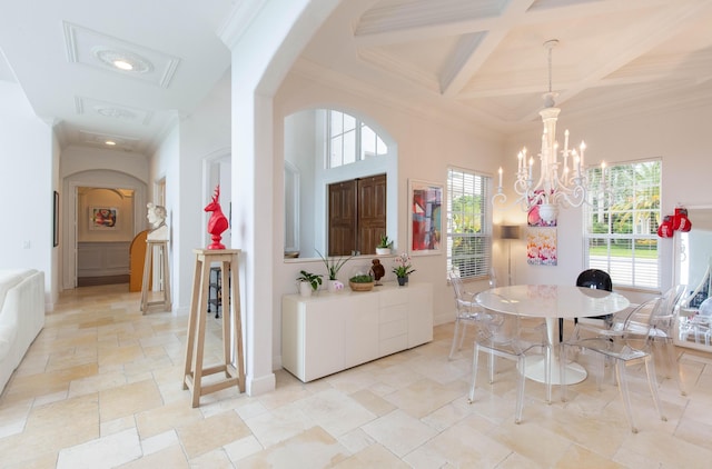 dining space with baseboards, arched walkways, coffered ceiling, stone tile flooring, and crown molding