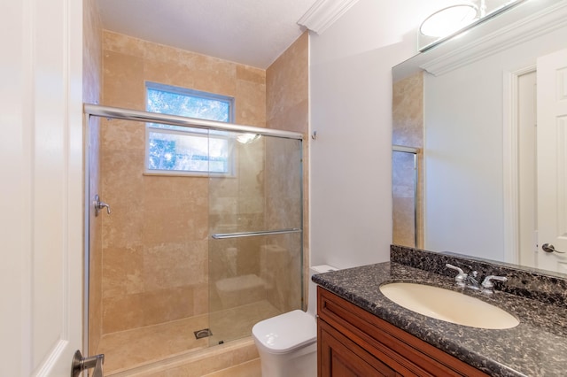 bathroom with an enclosed shower, crown molding, vanity, and toilet