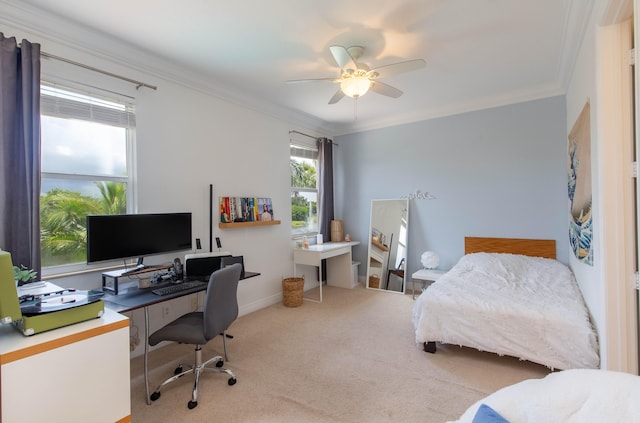 bedroom with ceiling fan, crown molding, and carpet floors