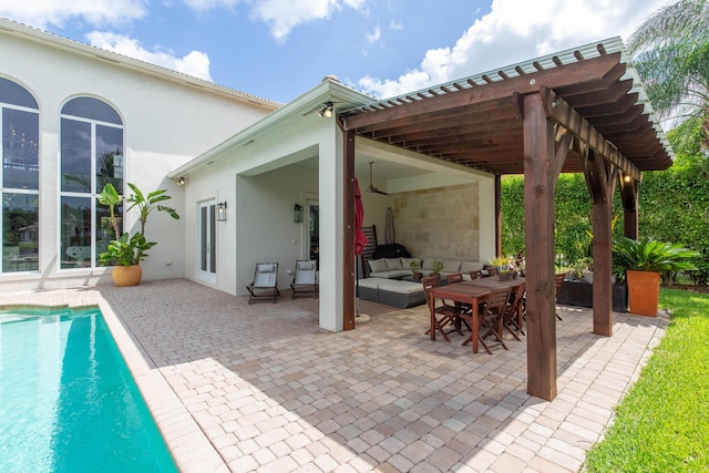 view of patio / terrace featuring an outdoor hangout area, a ceiling fan, and an outdoor pool