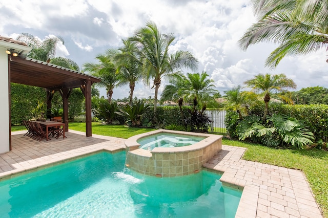 view of pool with an in ground hot tub, a pergola, and a patio