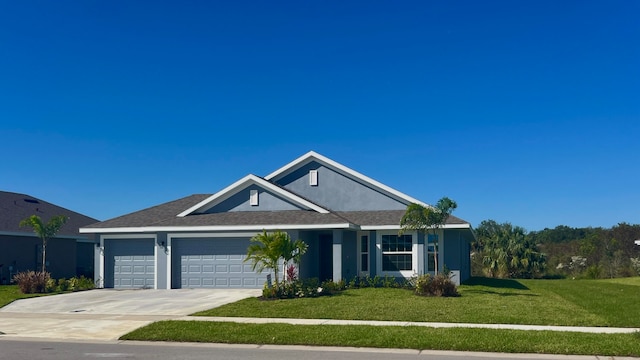 view of front of house featuring a front yard and a garage