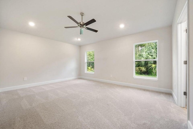 carpeted empty room with ceiling fan