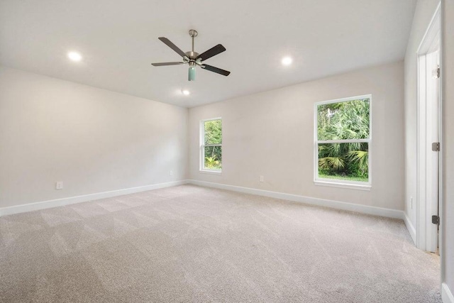 5483 Lugo St, Fort Pierce, FL 34951 - unfurnished room with baseboards, a ceiling fan, recessed lighting, and light colored carpet