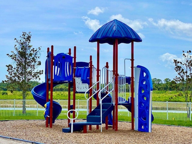 view of jungle gym with a water view