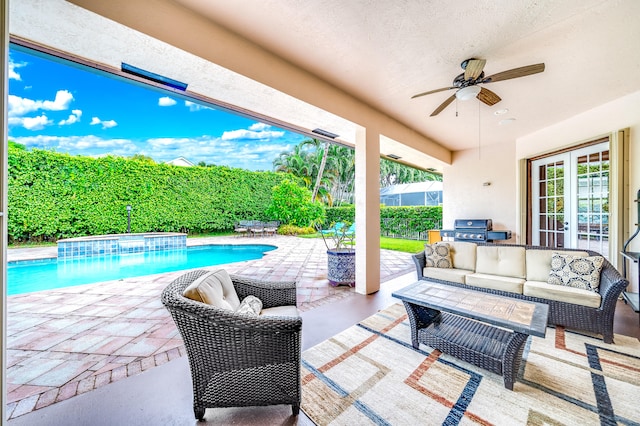 view of patio / terrace featuring area for grilling, an outdoor living space, a swimming pool with hot tub, and ceiling fan