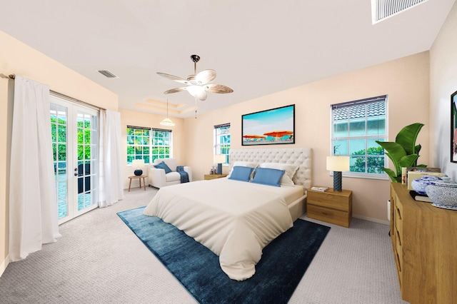 carpeted bedroom with access to exterior, ceiling fan, and french doors