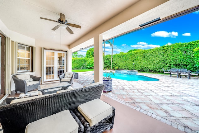 view of patio / terrace with an outdoor hangout area, a fenced in pool, and ceiling fan