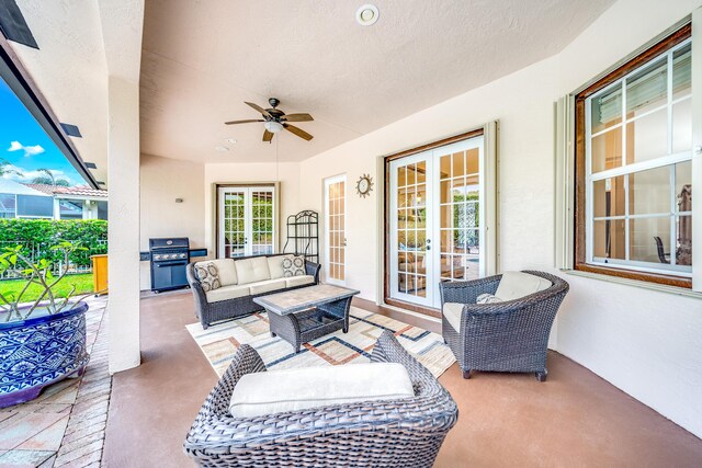 view of patio / terrace featuring ceiling fan, an outdoor hangout area, grilling area, and french doors